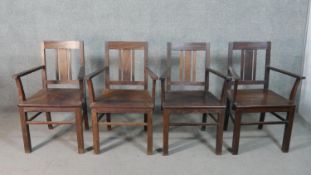 A set of four 20th century Indian rosewood open armchairs, with pierced solid seats, on square