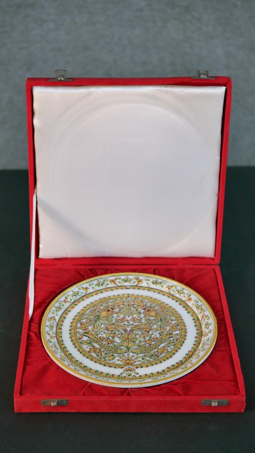 A boxed Indian hand painted and gilded white marble dish, decorated with birds, fish and flowers.