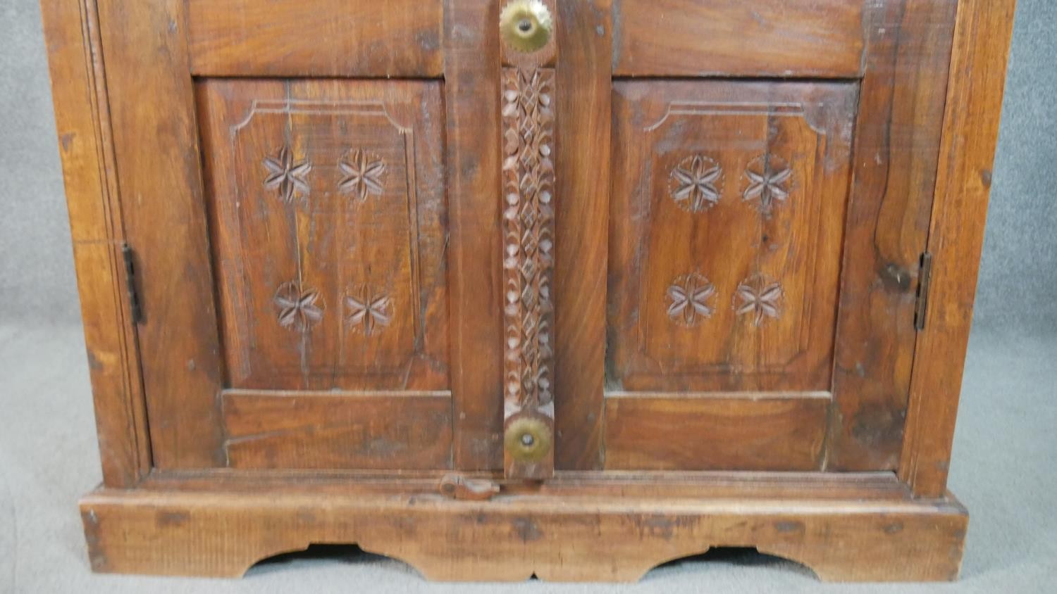 A 20th century Indian sheesham bookcase, the two doors with metal spindle panels, opening to - Image 7 of 8