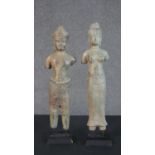 Two Khmer style bronze effect metal figures of two deities on display stands. H.46cm (largest)