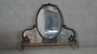 A Victorian carved mahogany mirrored backboard with floral and box motifs. (damaged to top moulding)