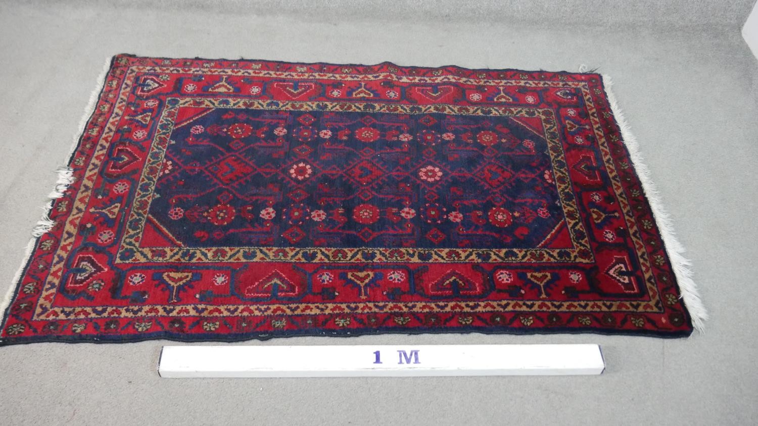 A Persian Hamadan rug with stylised hooked design on a midnight ground. L.170 W.110cm - Image 2 of 4