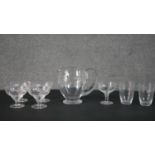 A collection of engraved glassware, including a set of four fern design dessert bowls, two floral