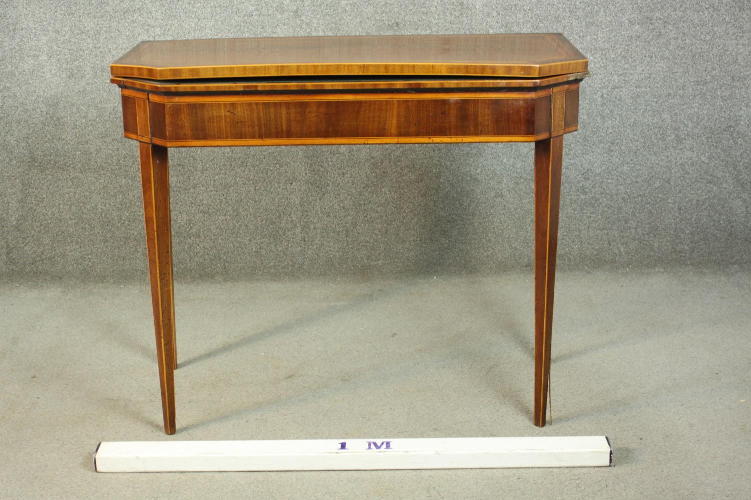 A Sheraton style mahogany card table, the rectangular top with canted corners, crossbanded with - Image 2 of 10