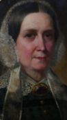 An oval gilt framed 19th century oil on canvas laid on board portrait of a woman in a lace bonnet