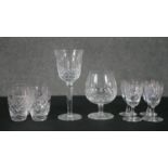 A collection of crystal drinking glasses, including a set of four sherry glasses, a set of four