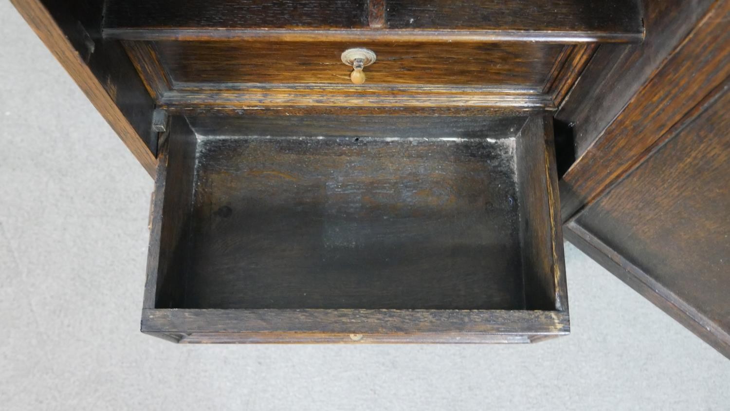 A Jacobean style oak cabinet with lozenge panel door enclosing a fitted interior on a barleytwist - Image 5 of 7