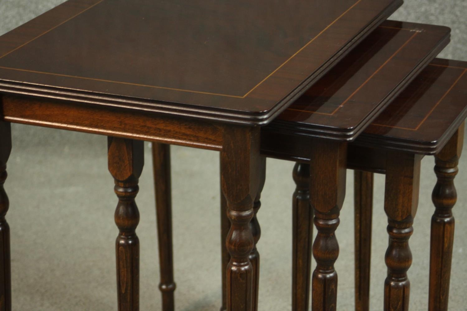 A reproduction mahogany and beech nest of three tables, with rectangular tops on turned and fluted - Image 6 of 7