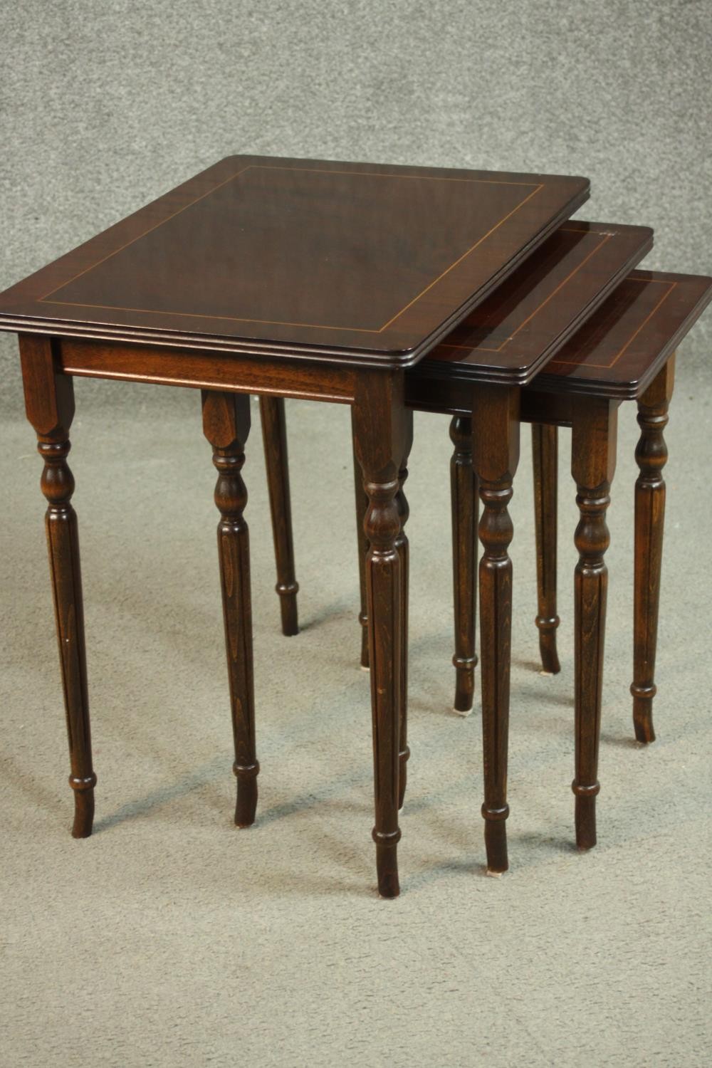 A reproduction mahogany and beech nest of three tables, with rectangular tops on turned and fluted - Image 5 of 7