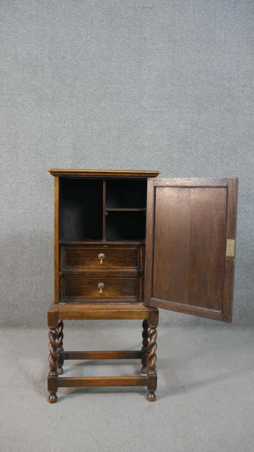 A Jacobean style oak cabinet with lozenge panel door enclosing a fitted interior on a barleytwist - Image 3 of 7