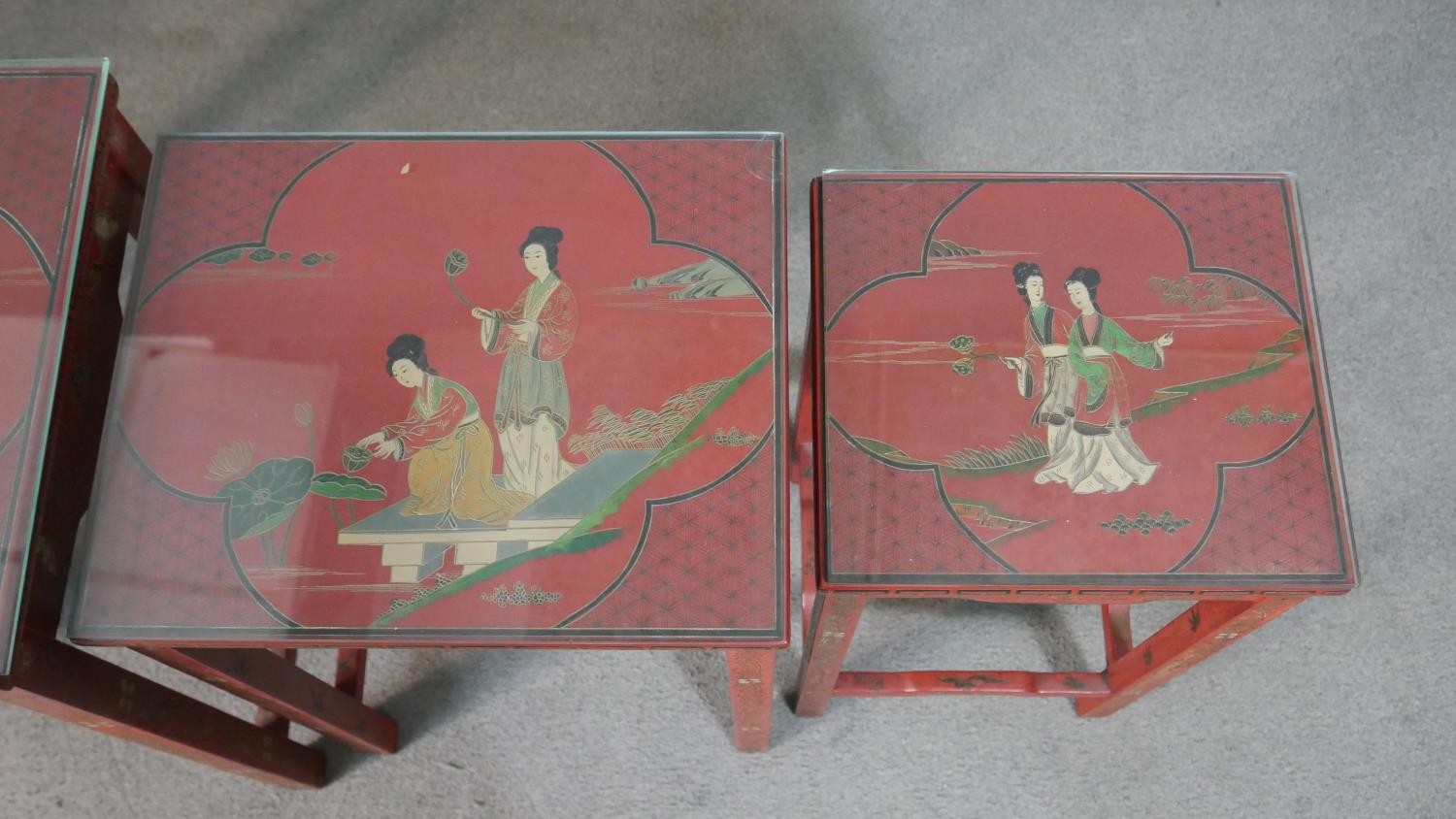 A quartetto of Chinese red lacquered occasional tables, of rectangular form, painted with figures in - Image 4 of 11