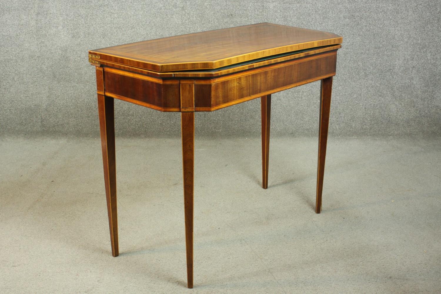 A Sheraton style mahogany card table, the rectangular top with canted corners, crossbanded with - Image 3 of 10