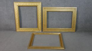 Three giltwood picture frames, two with a repeating geometric design. H.75 W.86cm