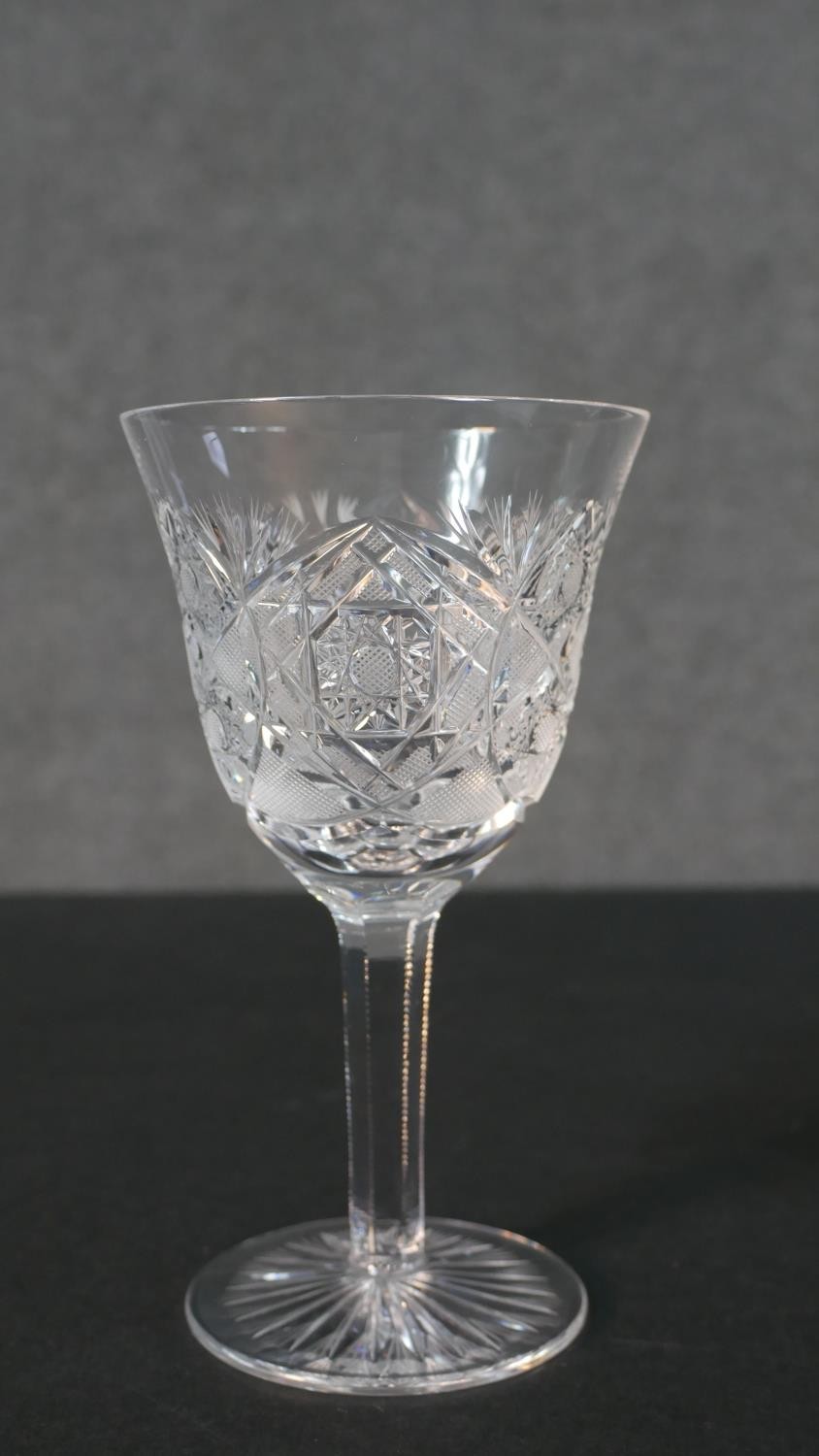 A set of seven hand cut sherry glasses with a star cut bases. H.17 Diam.10cm - Image 5 of 7