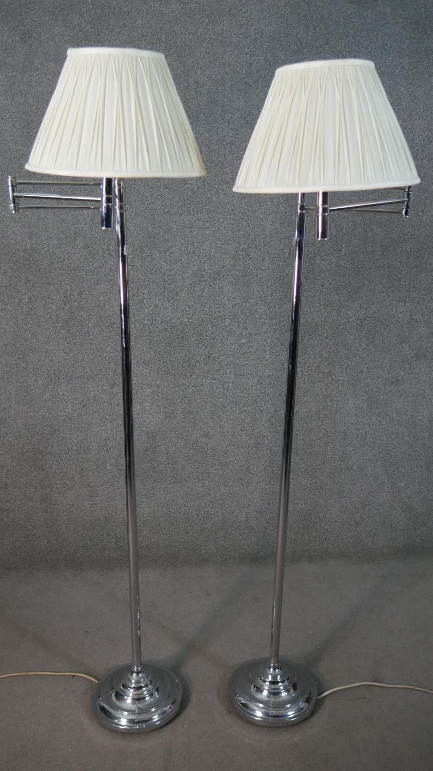 K&L Belysning Co, Denmark, a pair of circa 1960s adjustable chrome reading lamps, with white pleated