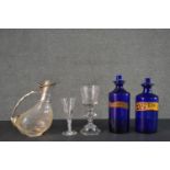 A collection of 19th century glass ware, including two Bristol blue apothecary bottles with stoppers