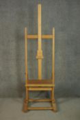 An artist's beech adjustable studio easel. H.180 W.50cm. (extendable)