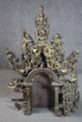 A 19th century carved gilt wood and lacquered top to a Burmese throne, decorated with stylised