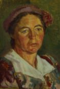 A gilt framed oil on board portrait of a woman in a pink beret, unsigned. H.66 W.50cm.