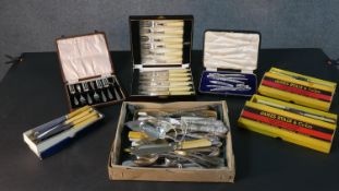 A collection of silver plate and stainless steel cutlery, including a cased six person fish set, a