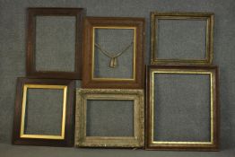 A collection of six picture frames, including two carved giltwood frames one with laurel leaf