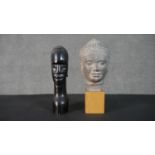 Two bust figures, one tribal carved hardwood and the other a Louvre Museum replica of an Angkor