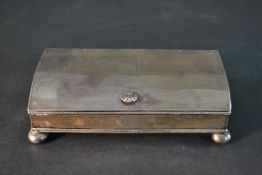 An early 20th century silver desk ink well with two silver topped glass ink well and a central