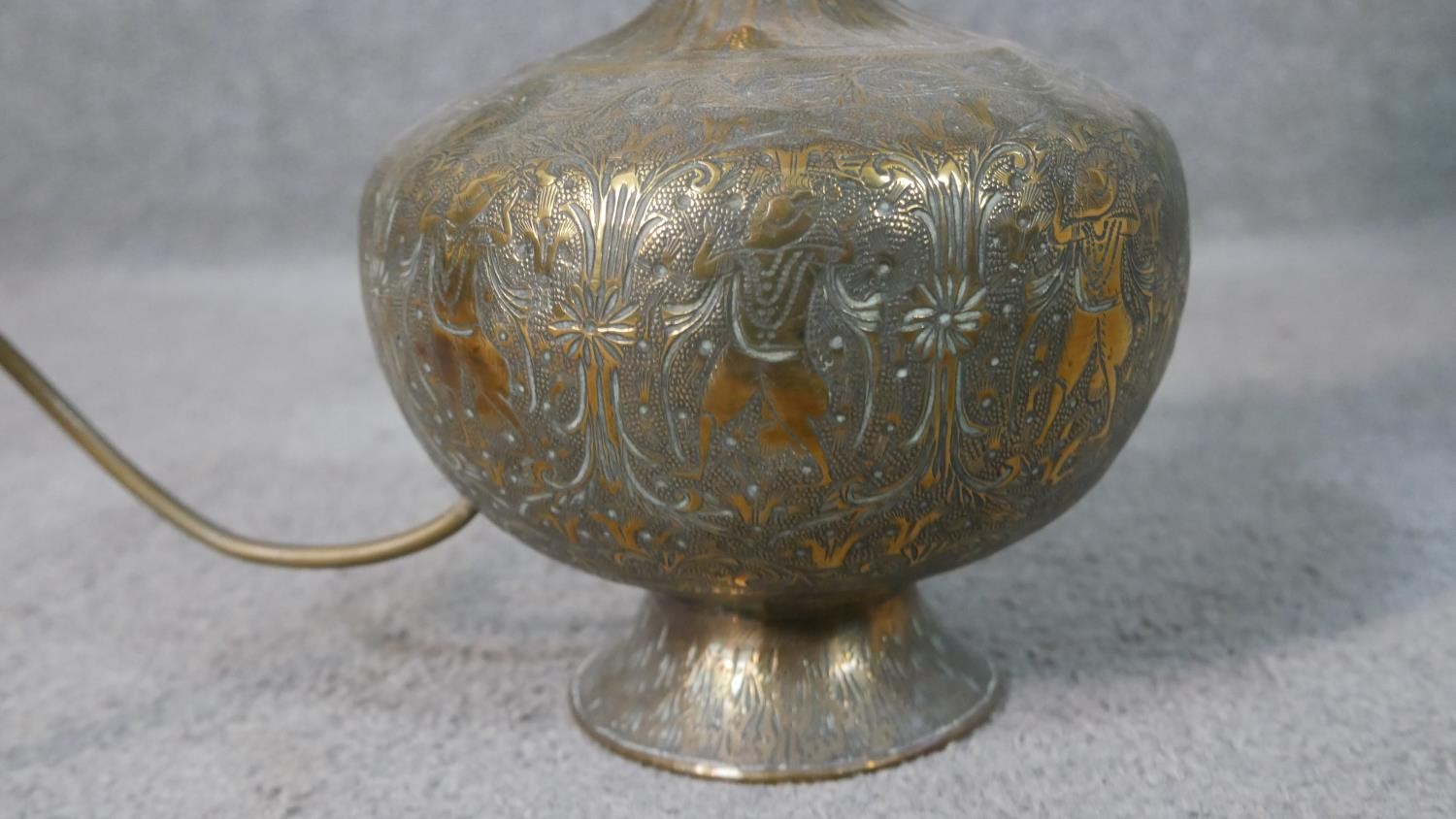 A pair of Indian engraved brass vases converted into table lamps, each with a figural design. H.60cm - Image 9 of 10