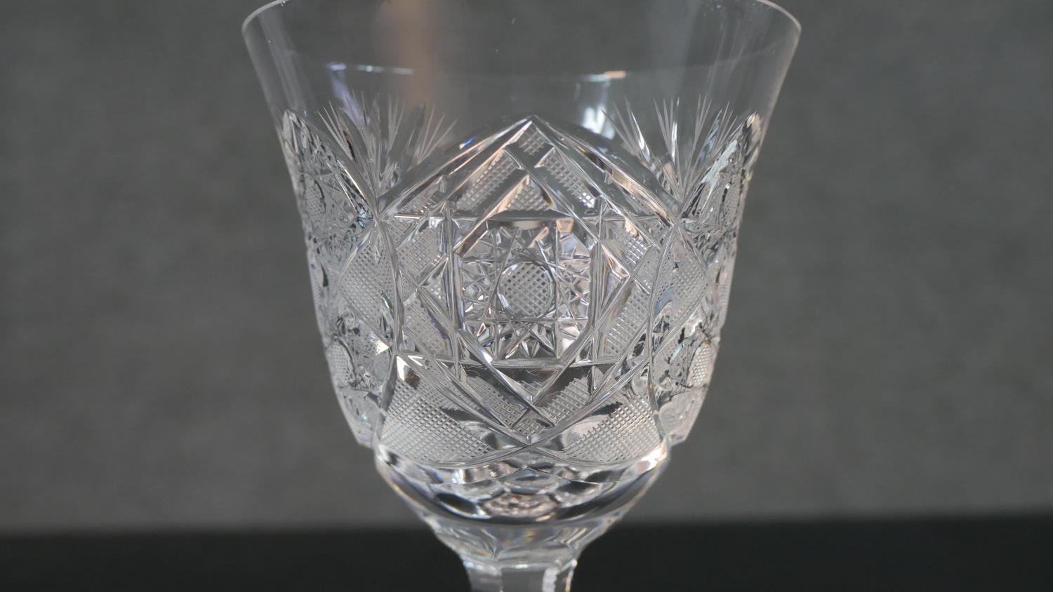 A set of seven hand cut sherry glasses with a star cut bases. H.17 Diam.10cm - Image 6 of 7