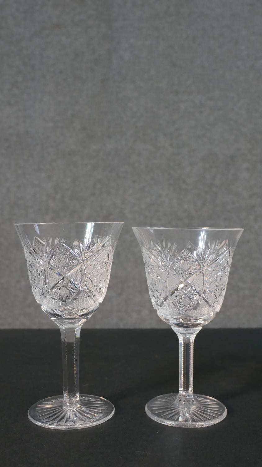 A set of seven hand cut sherry glasses with a star cut bases. H.17 Diam.10cm - Image 3 of 7