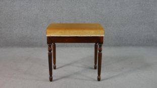 A Victorian style stool, upholstered in golden velour, on turned and reeded legs. H.52 W.51 D.35cm