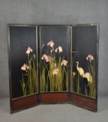 A gilded and lacquered silk embroidered three fold Japanese screen, one side decorated with pink