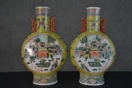 A pair of large late 19th - early 20th century Chinese Famille Rose moon flasks, one side