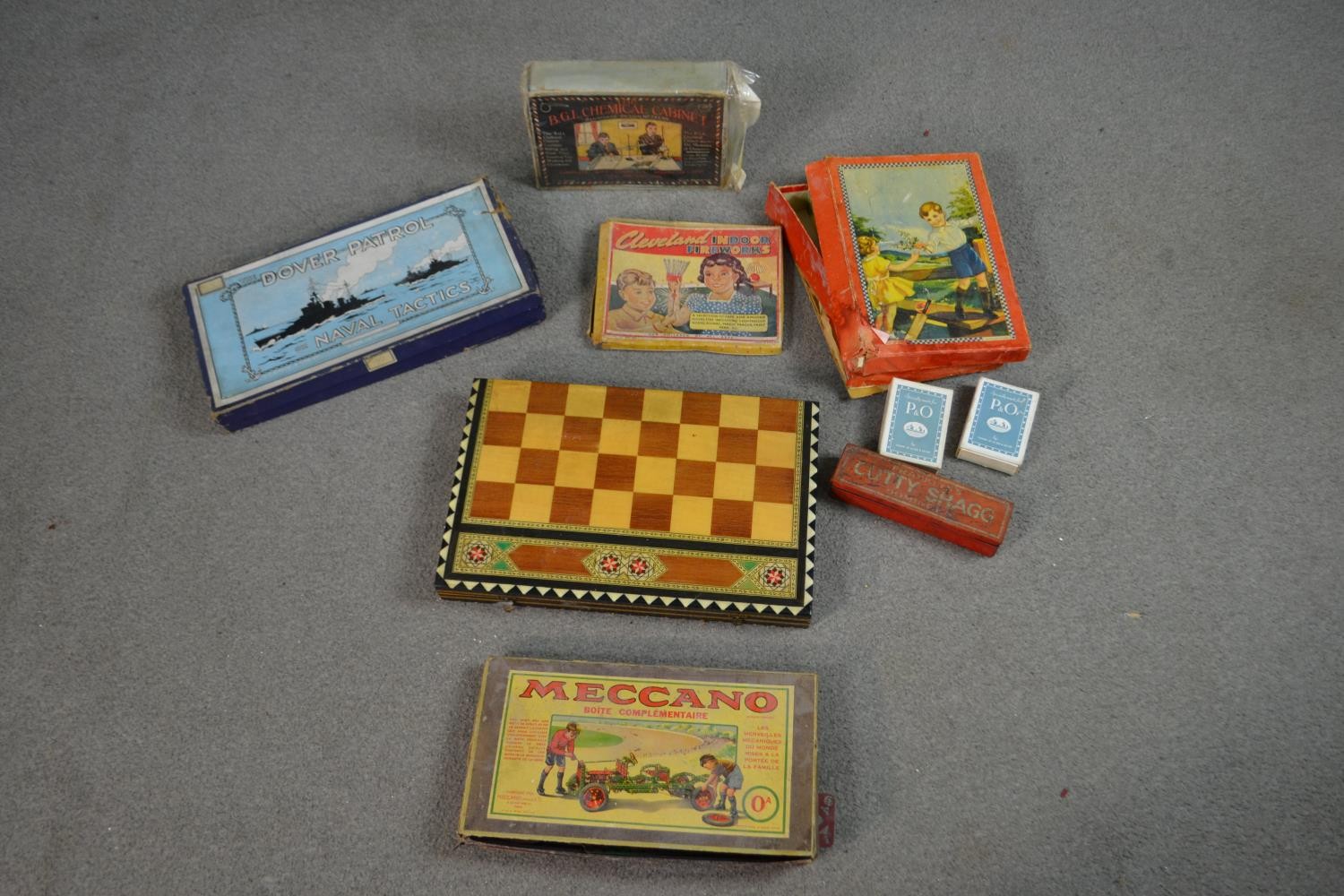 A collection of vintage games and activity sets, including a Meccano set, Dover Patrol, B.G.L.