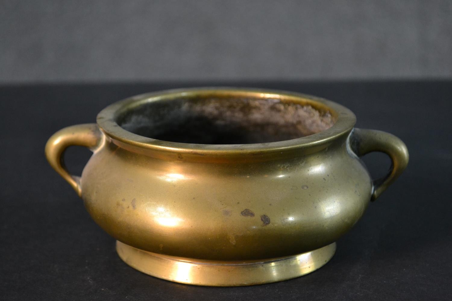 A Chinese bronze censer with apocryphal six character Xuande period mark to base. H.7 W.18cm