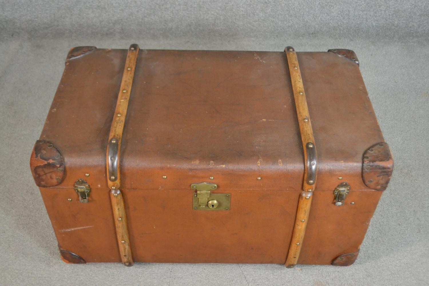 An early 20th century brown travel trunk, with wood bracing and brown leather corners. (locked) H.42 - Image 2 of 7