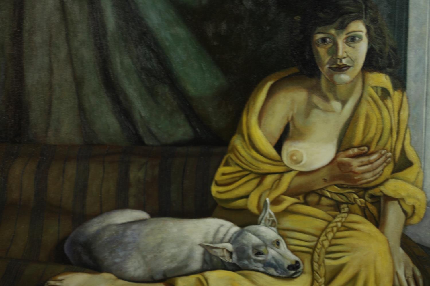 A carved framed oil on canvas of a nude woman and British bulldog on a couch. H.72 W.82cm.
