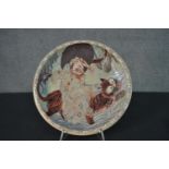 A Japanese 19th century Kutani ware bowl with an immortal riding a tiger, cloud motifs to the