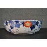 An early 20th century Japanese Fukagawa Sei Arita ware hand painted porcelain bowl with blue, orange