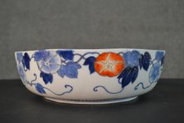 An early 20th century Japanese Fukagawa Sei Arita ware hand painted porcelain bowl with blue, orange