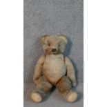 A 19th century large mohair humpback teddy bear with jointed limbs. H.51cm