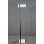 Thorn Lighting, Germany, a circa 1980s EMI uplighter lamp, with a white half cylinder shade and
