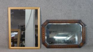 Two wall mirrors, one with a pine frame and one carved oak. H.77 W.57cm (largest)