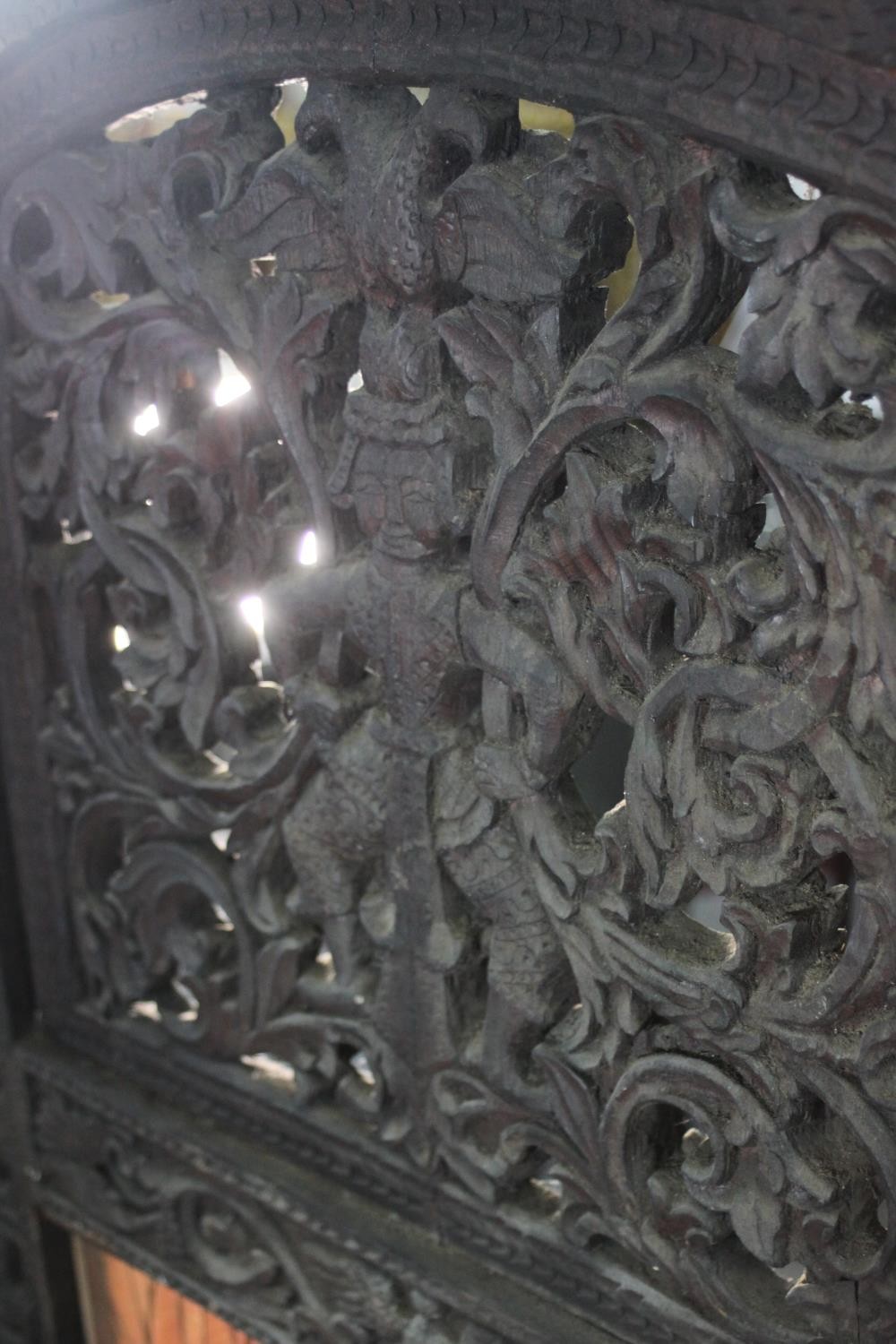 An ornately carved and pierced wood screen, possibly Burmese, of three folds, each with two panels - Image 6 of 7