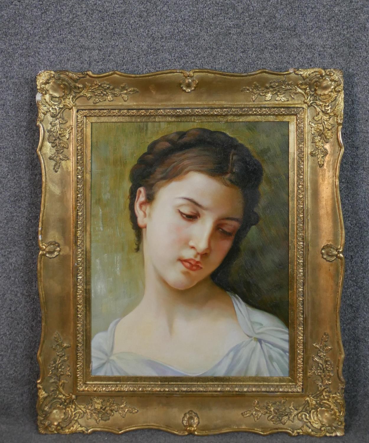 A gilt framed oil on canvas portrait of a young woman with plaited hair. H.69 W.57cm. - Image 2 of 6