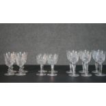 A collection of fourteen cut crystal glasses, including a set of four hand cut Edinburgh crystal