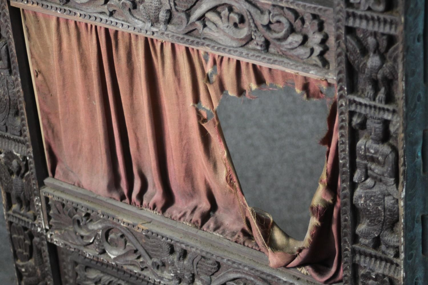 An ornately carved and pierced wood screen, possibly Burmese, of three folds, each with two panels - Image 4 of 7