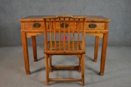 A Chinese elm writing table and chair, the writing table of rectangular form with three short