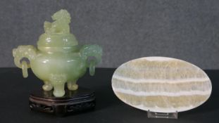 An early 20th century carved jade lidded censer with foo dog finial and handles along with a