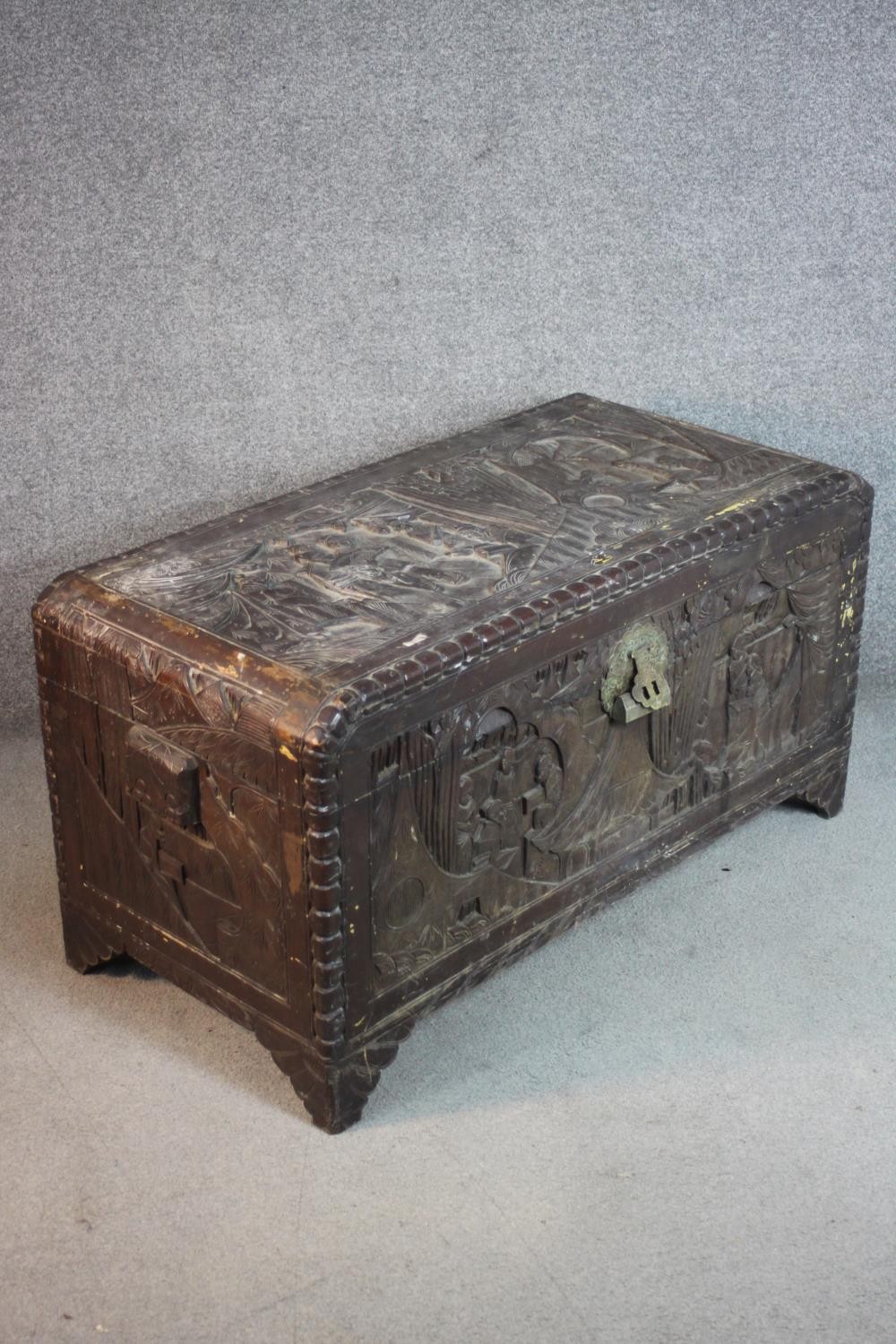 An early 20th century Chinese camphorwood chest, the exterior carved allover with figures amongst - Image 3 of 11